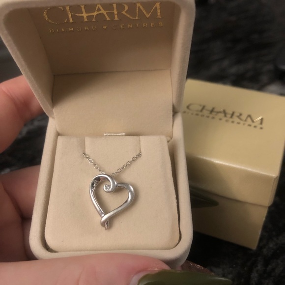 Selling a sterling silver diamond heart pendant with a spring-ring clasp. - Picture 1 of 2